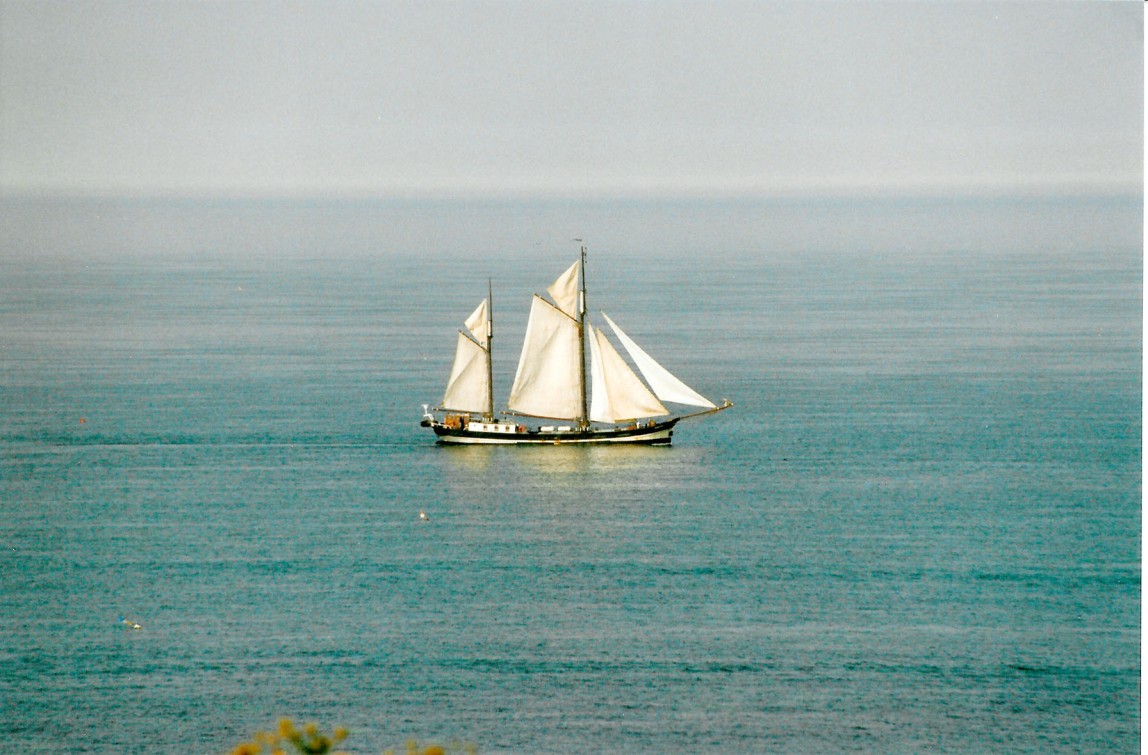 An old time sailing ship on a calm sea